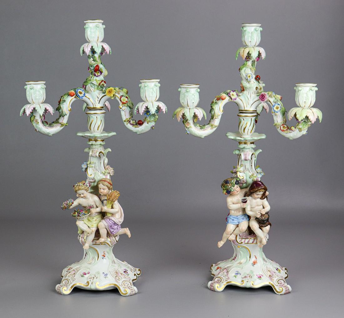 Pair of 4-light Meissen candelabra, 1860-1924,: Pair of 4-light Meissen candelabra 1860-1924. One with figures emblematic of "Summer" and "Winter," the other with "Spring" and "Autumn." Each with underglaze blue crossed swords marks, Ome incised "E