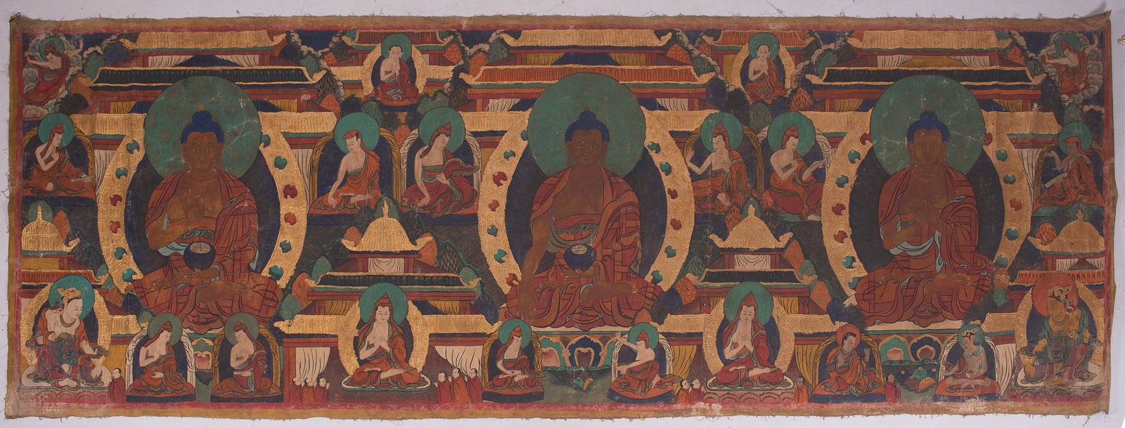11 ft Tibetan Buddhist Thangka Painting: 11 ft Tibetan Buddhist Thangka Painting, 20th c, oil and gold gilt on cloth measures 49" x 134" , good condition with wear