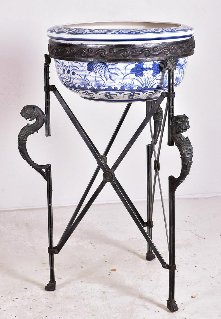 Maitland Smith Chinese Blue & White Fish Bowl on Stand: Maitland Smith Chinese blue and white porcelain fish bowl, Directoire style metal stand with lion's heads, bowl 22-3/4" dia x 12" h, 45-1/2" h x 28" dia overall