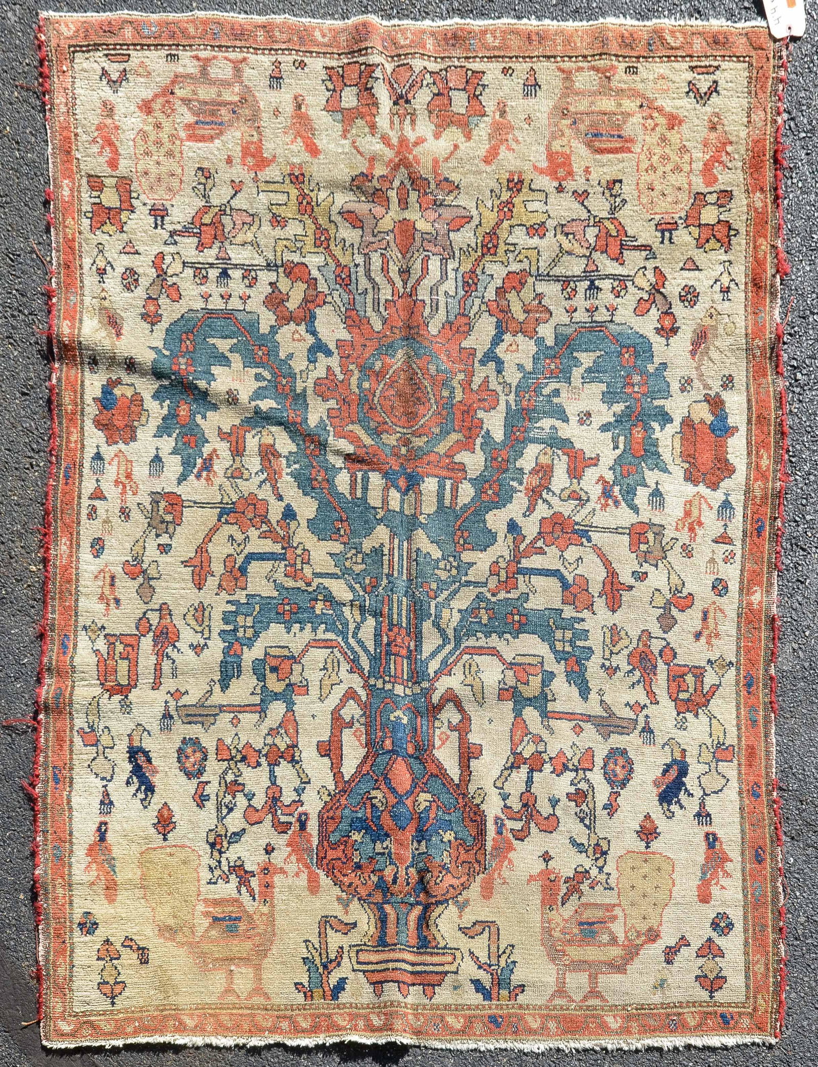 4'4" X 5'9" tribal Lilihan Area Rug: 4'4" X 5'9" tribal Lilihan Area Rug with urn and peacock motif, fraying to overcast edge, wear, fading and stains, Carpet has age, but cannot say how old it is. Foundation in good shape. Oxidation, mo