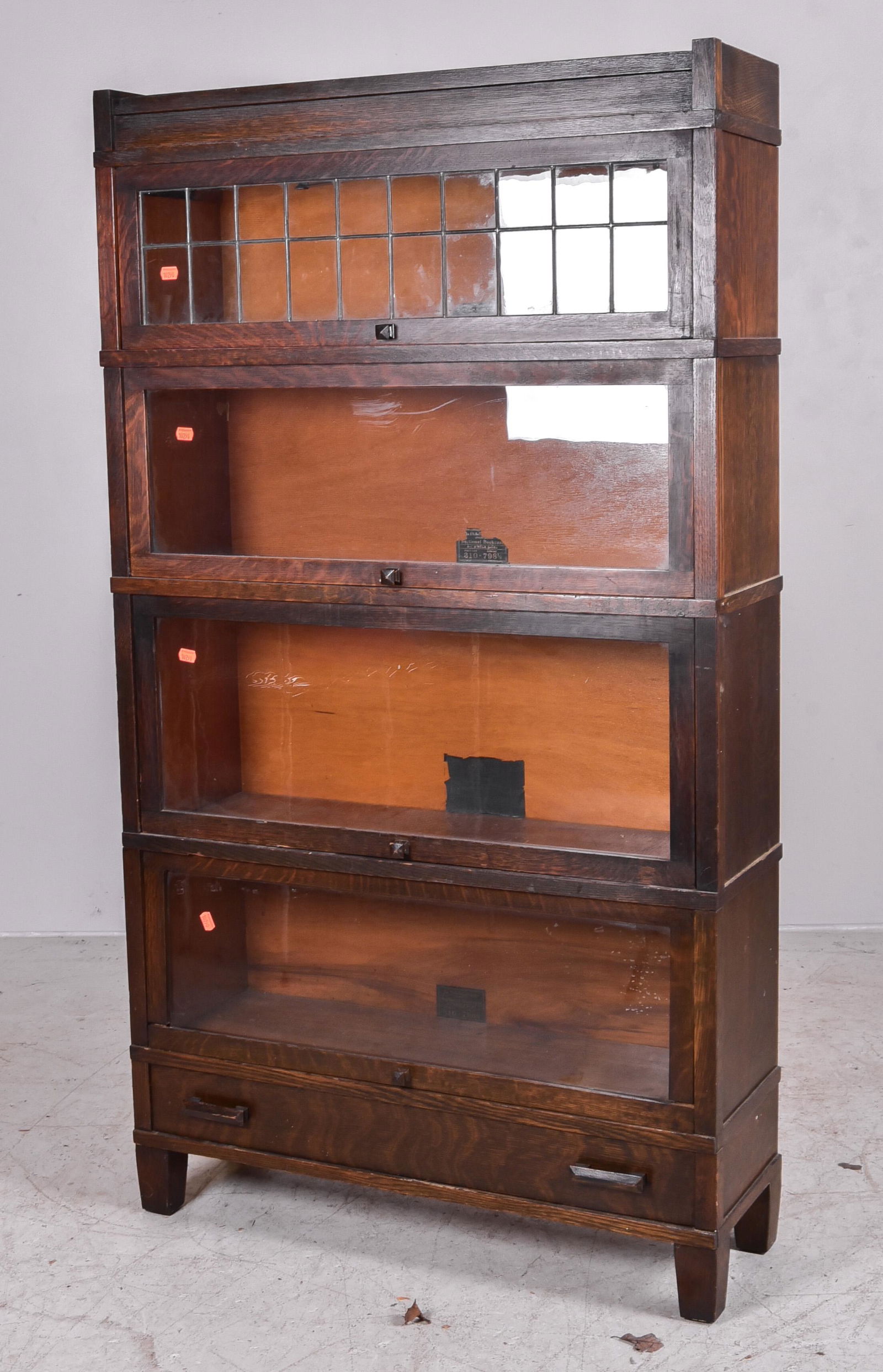 Globe Wernicke oak sectional bookcase: Globe Wernicke oak sectional bookcase, pattern 308 and 310, grade 798-1/2, base with single drawer, 63"h x 35"w