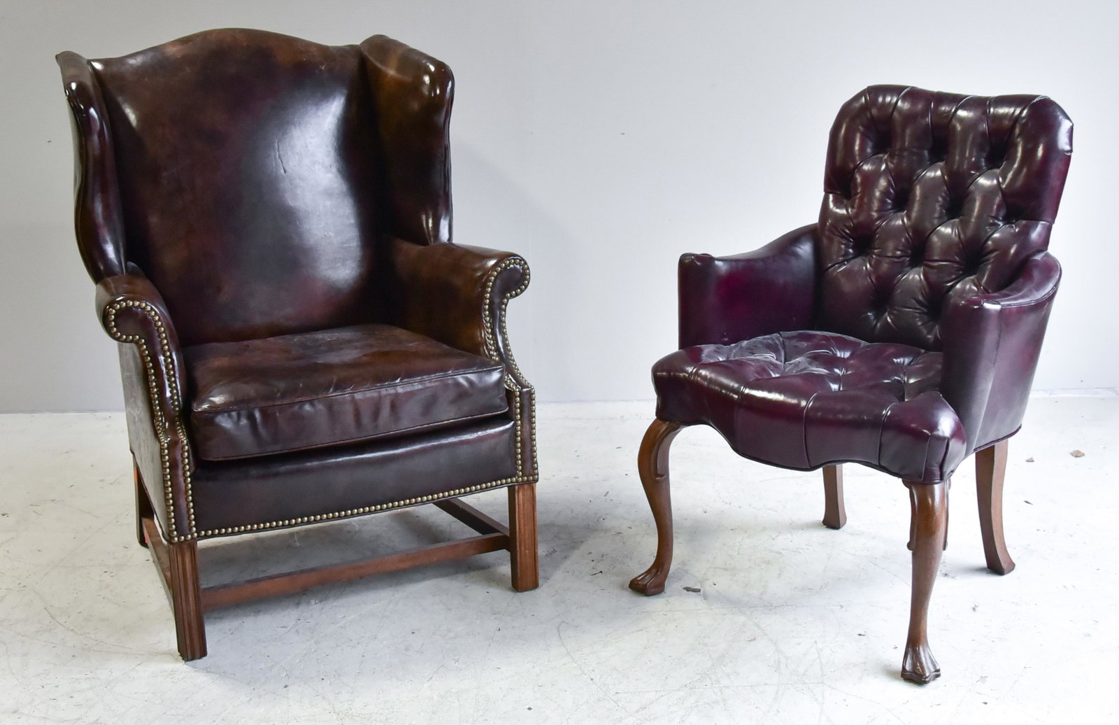 Sherrill Chippendale style wing chair, tufted red: Sherrill Chippendale style wing chair, distressed brown naugahyde upholstery, 41"h, seat height 16"h, along with tufted red naugahyde upholstered office chair