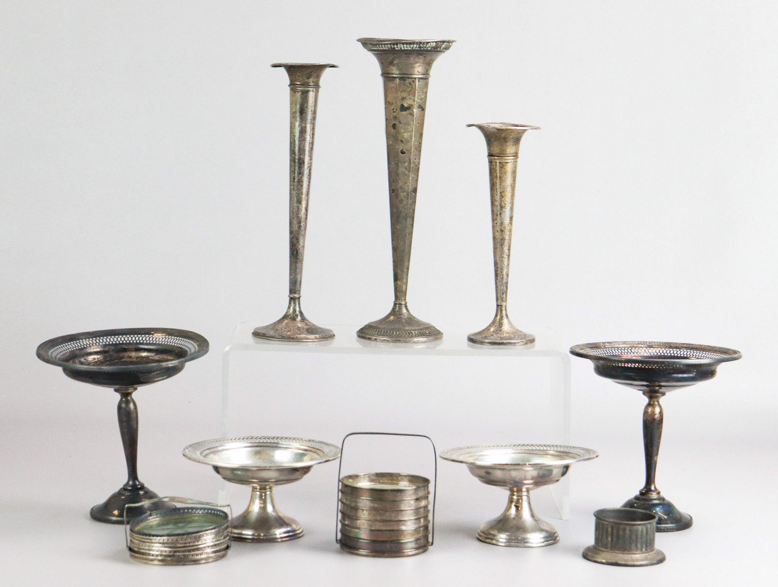 Lot of Weighted Sterling Silver: Lot of weighted sterling silver, c/o pair of Matthews Co reticulated compotes, pair reticulated compotes with trophy engravings, (3) trumpet vases, (2) sets of sterling rimmed glass coasters, frame wi