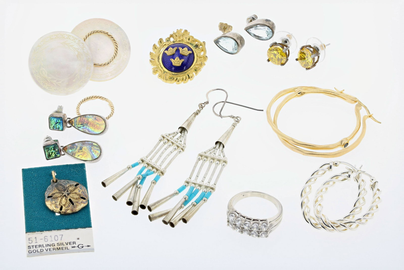 Silver and Gold Jewelry Lot: Silver and Jewelry Gold Lot C/O: (1) 10K white gold ring set with clear stones sz. 7.25; 3.2 Dwt.(1) Pair of gold plated silver hoops, marked LIRM 925 with bezel set sapphires, (1) pair of Mother of p