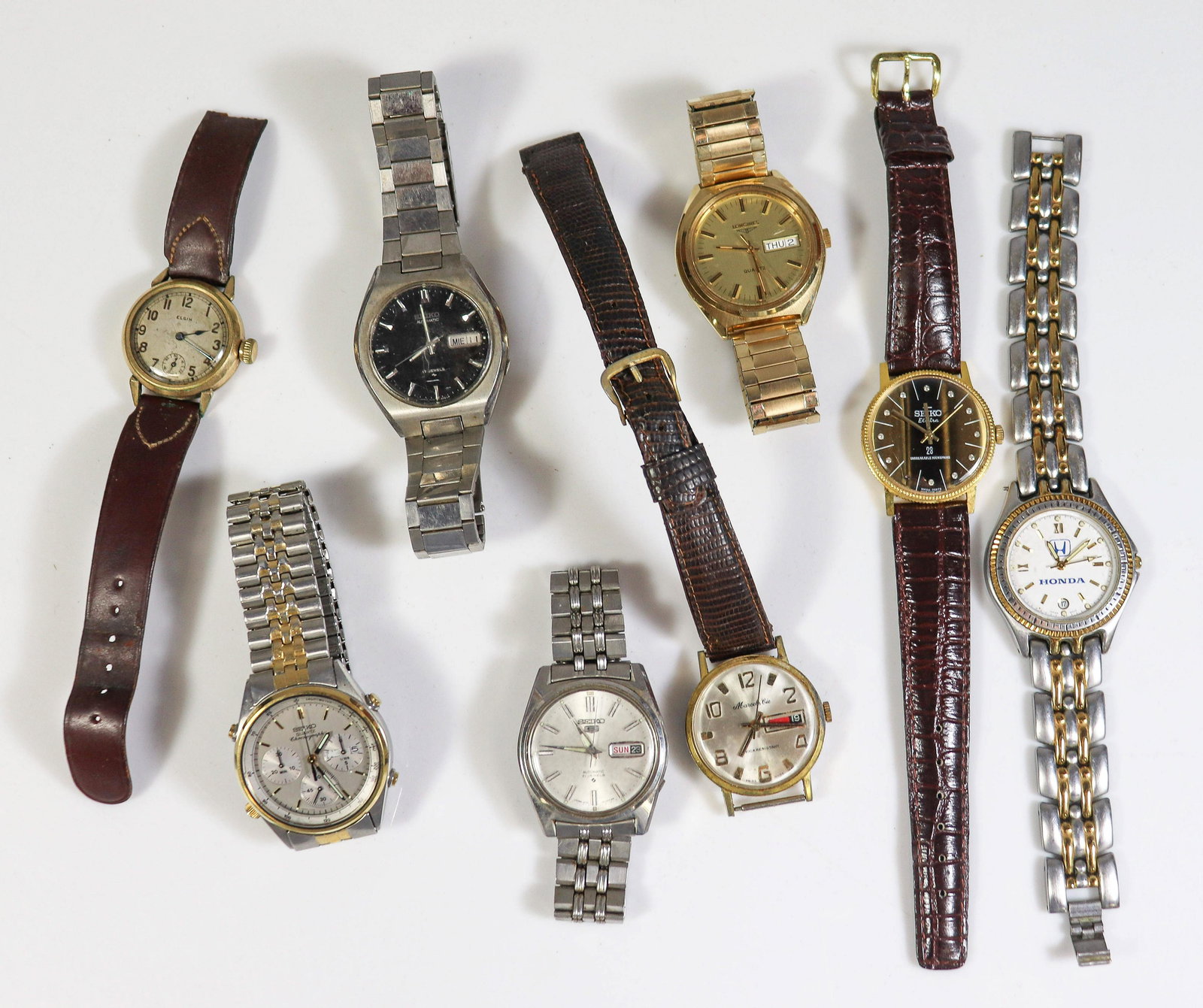8 Men' s Wrist Watches: (8) Pc Men's Wrist Watch Lot C/O; (1) Vintage Elgin, damaged band, (1) Quartz Longines, Gold tone(1) silver tone Seiko Automatic 21 Jewels, (1) Seiko Automatic 17 Jewels, (1) Seiko Electra Gold tone (