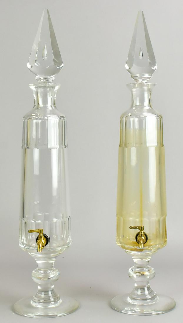 Pair Val St. Lambert Liquor Dispensers: Pair Val St. Lambert liquor dispensers, brass dispenser at front, vial form with pointed finials, suspended bubble at center, 21-1/2" h