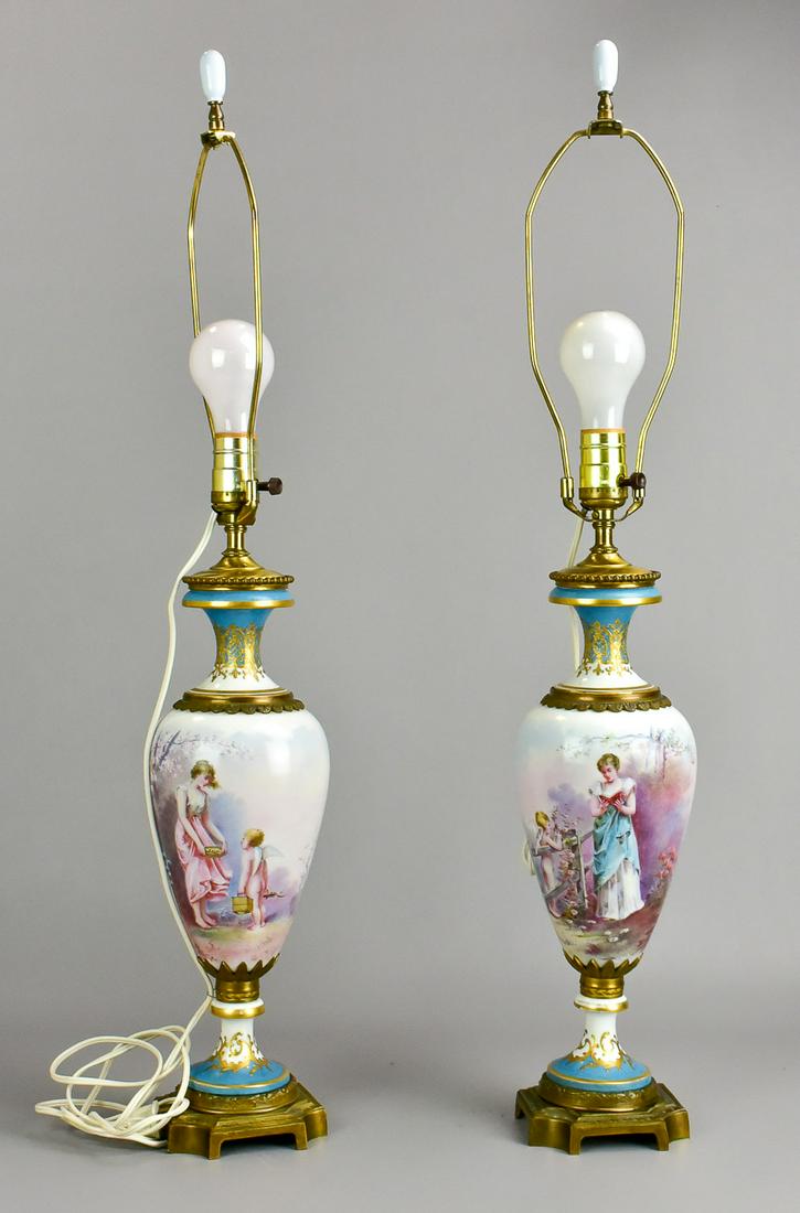 Pair of Sevres Style Urn Form Table Lamps: Pair of Sevres style urn form table lamps, hand painted scenes of women with cherubs, one signed Daly, mark on base, 15-1/2" h to top of vase, 30-1/4" h overall, Very good condition, divot in 1 lamp, 