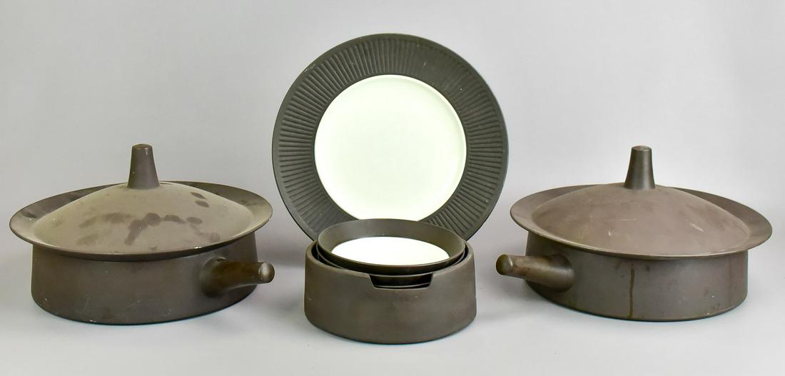 (7) Pcs Dansk Quistgaard Flamestone: (7) Pcs Dansk Quistgaard flamestone to include (2) 3 quart covered round lidded bakers, (3) coup cereal bowls, utensil marks on bowl centers, (1) pc warming stand and serving plate.