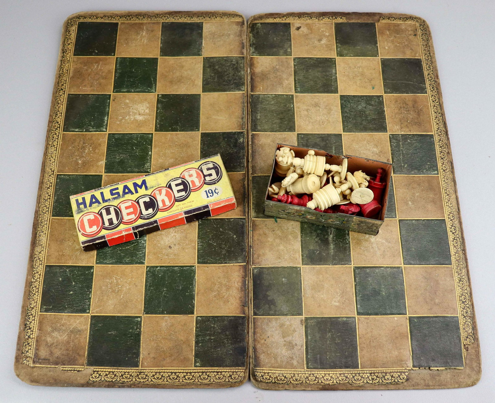 Bone Chess Set with Leather Board: Bone chess set, 32 men (2 need repair), tallest 3-1/4", 2-piece leather board 21" x 21-1/4" overall, with Halsam checker set in original box
