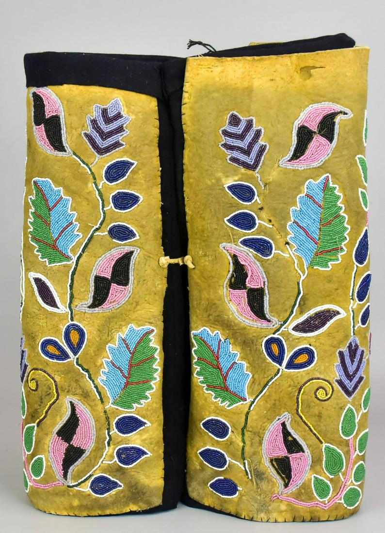 Beaded Brain Tanned Hide: Beaded brain tanned hide, plains Indian, affixed to wool bundles, in crawling multicolor glass beaded leaf decoration