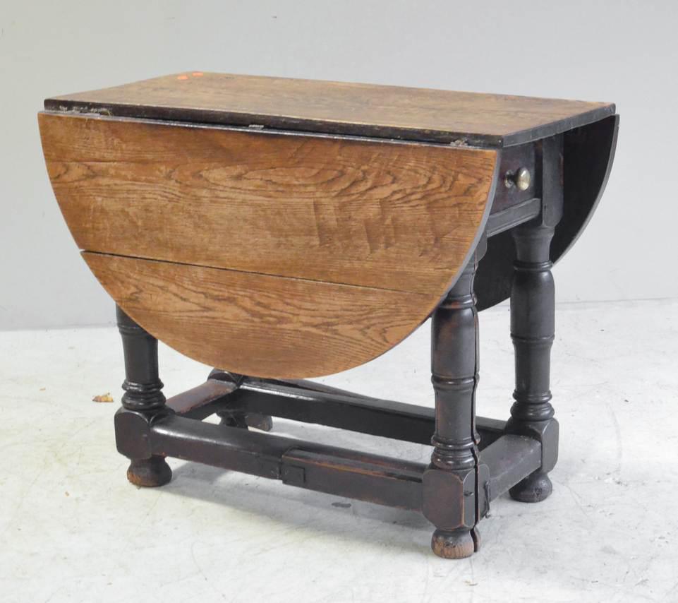 Oak Jacobean gateleg table: Oak Jacobean gateleg table, rectangular top with rounded leaves, split leg gateleg support with outside stretcher base, one drawer, base in old crusty finish, 36-3/4"l x 16-1/2"w x 16-1/2" leaf, 28-1/