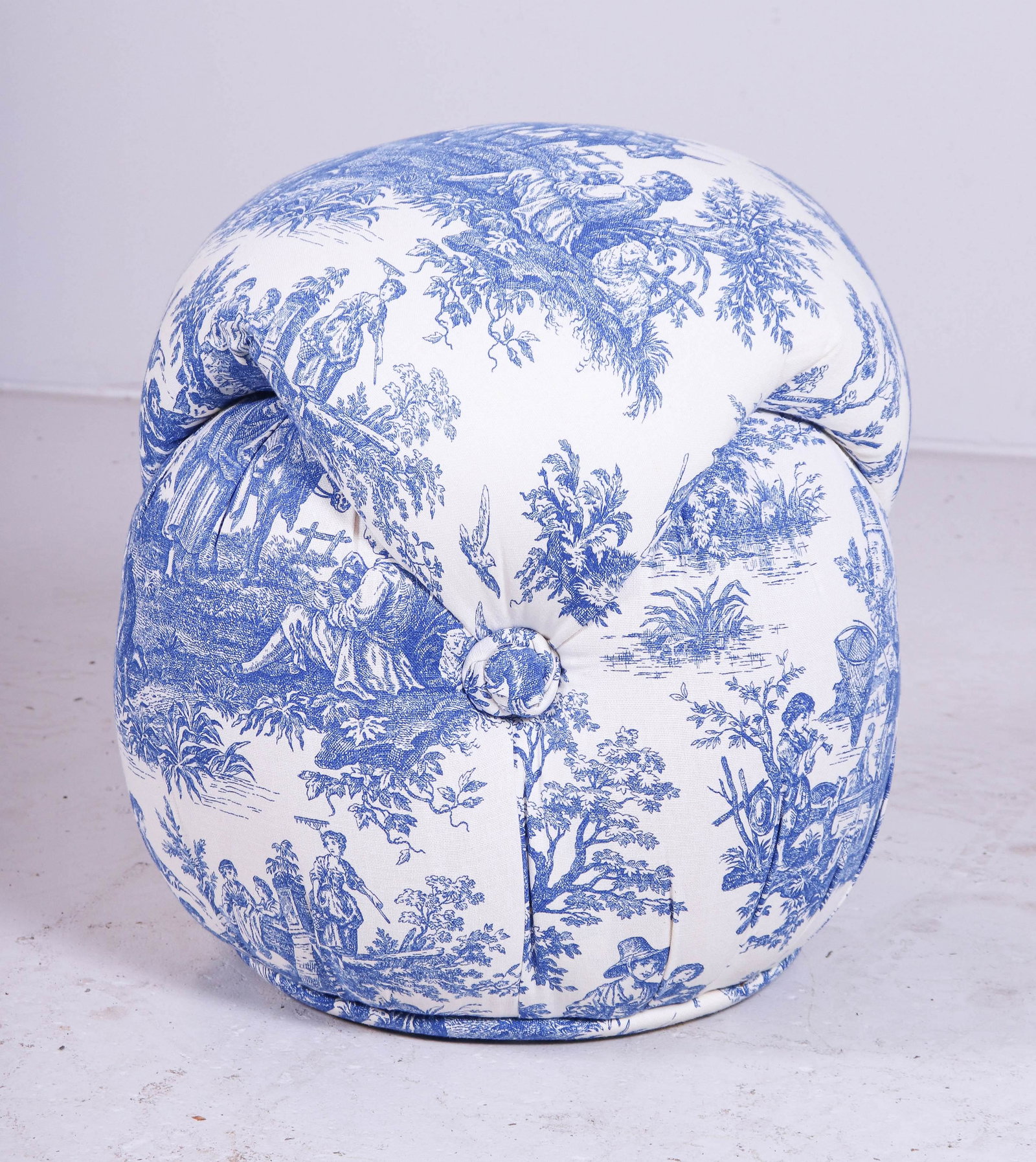 Upholstered tufted poof footstool: Upholstered tufted poof footstool, figural upholstery, 18-1/2"h x 17"diameter