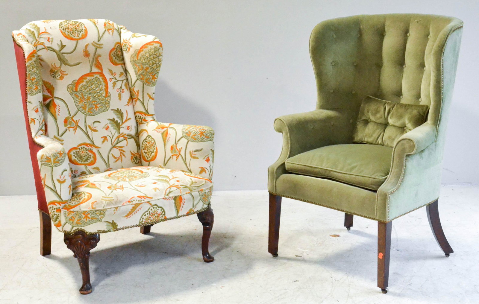 (2) Upholstered armchairs: (2) Upholstered armchairs, c/o QA style wing chair with crewel work upholstery, barrelback tufted armchair, largest 46"h, seat height 22"h to top of cushion, wing chair with soiling to upholstery