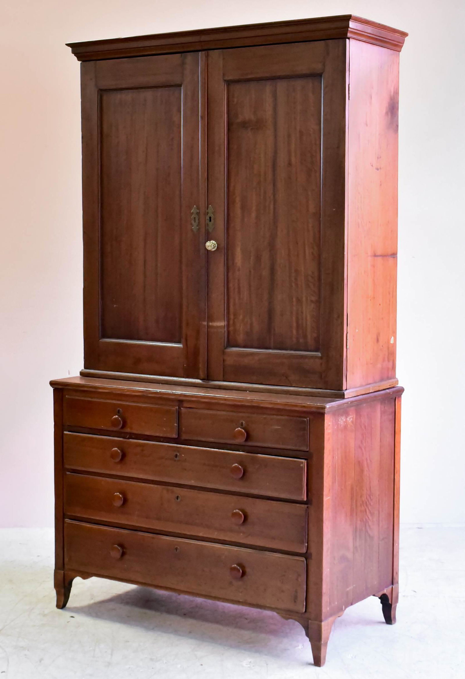 2-pc Cherry Federal Linen Press: 2-pc Cherry Federal Linen Press, top with two paneled doors with interior shelving, base with two short lipped drawers over three long drawers, wood pulls, 87-3/4"h x 47-3/4"w, replaced feet, c 1790-1