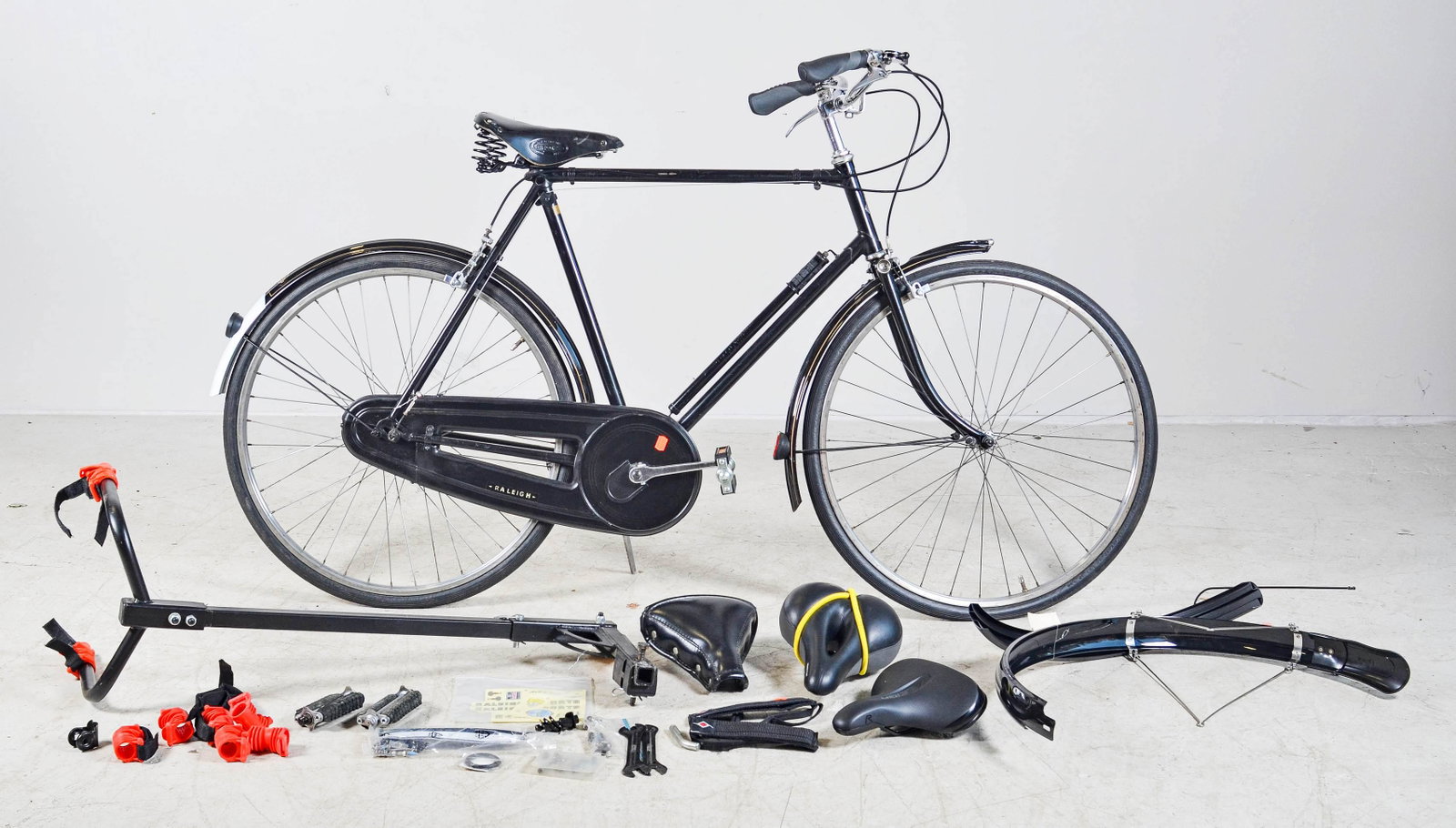 The Raleigh Nottingham England bicycle: The Raleigh Nottingham England bicycle, black, leather embossed seat marked Brooks, along with bike parts and rack