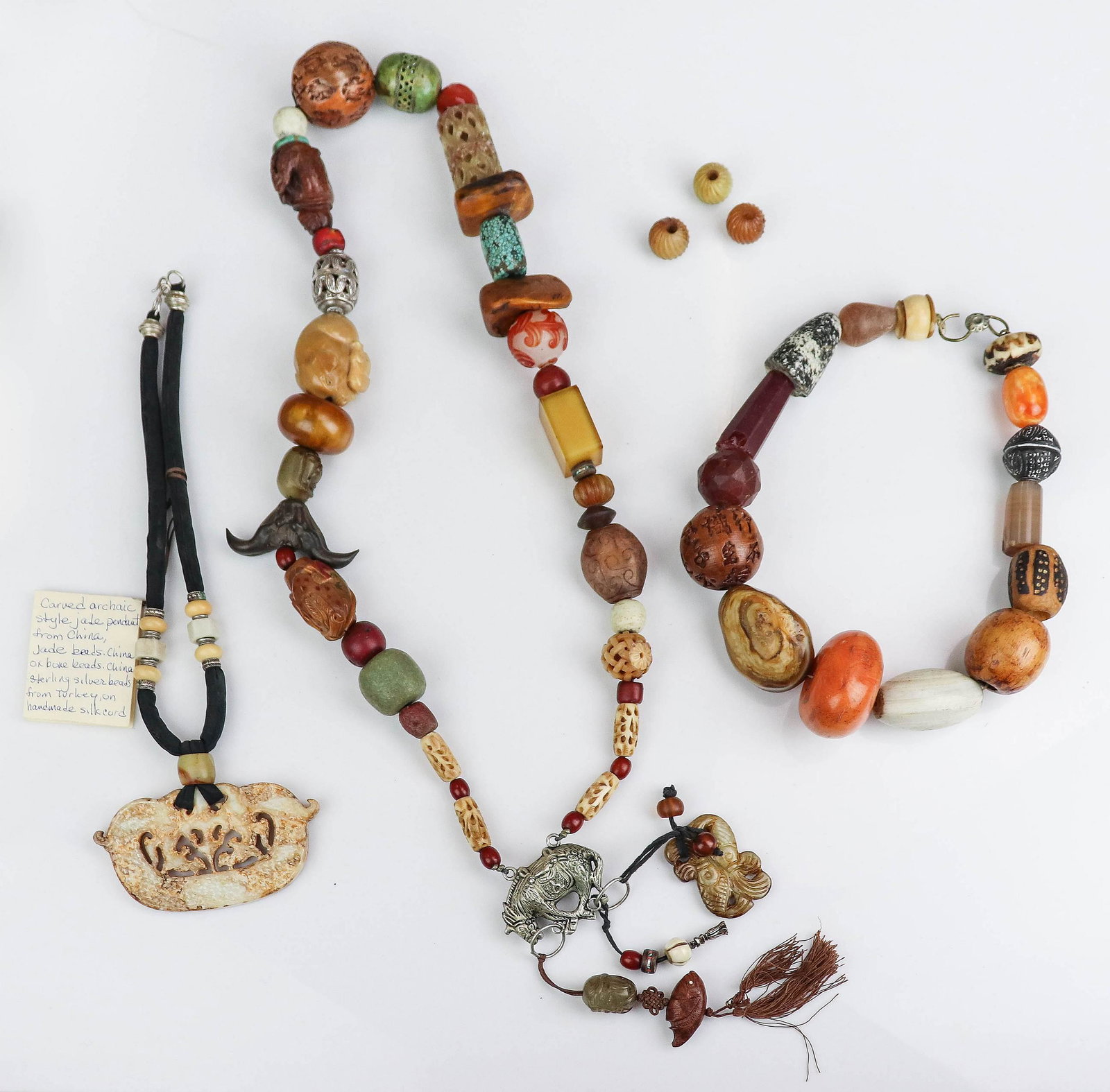 (6) Pc Lot of Carved Chinese Beaded Jewelry: (6) Pc Lot of Carved Chinese Beaded Jewelry, lot C/O: (1) Brooke Jaron Necklace, (1) carved Asian beaded necklace with tassel charms and carved figural beads (1) 20" Large Bead Necklace, carved stones