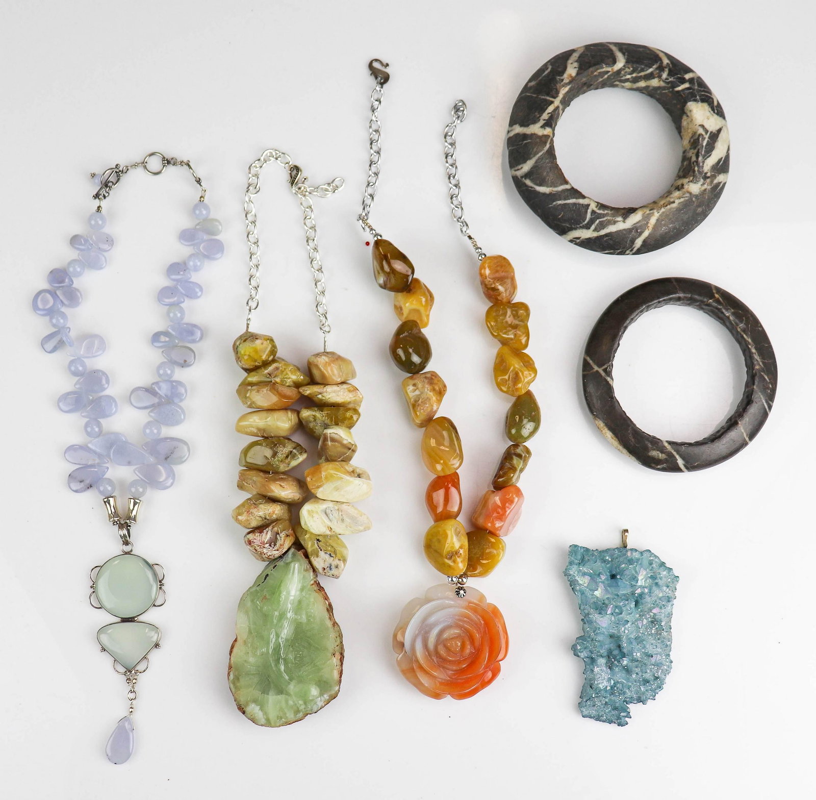 (6) Pc Lot of Statement Jewelry: (6) Pc Lot of Fashion Statement Jewelry; Lot C/O; (1) blue druzy stone pendant 4 x 2.5" (2) large carved stone bangles, (1) Agate carved flower necklace, 23"+3" pendant, (1) Large carved green stone q
