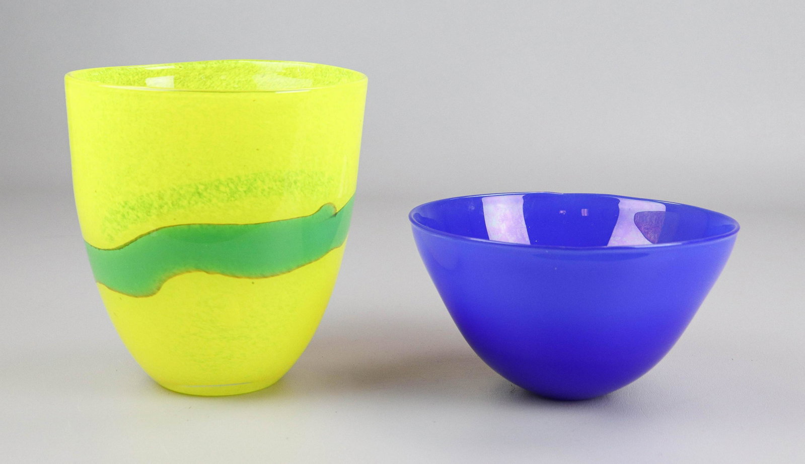 (2) Hand Blown Art Glass Bowls: (2) Hand Blown art glass bowls to include Jane Bruce hand blown cobalt blue art glass bowl, signed at underside, 7-1/2" diam x 4-1/4" h, excellent condition and Kjell Engman style Swedish blown glass 