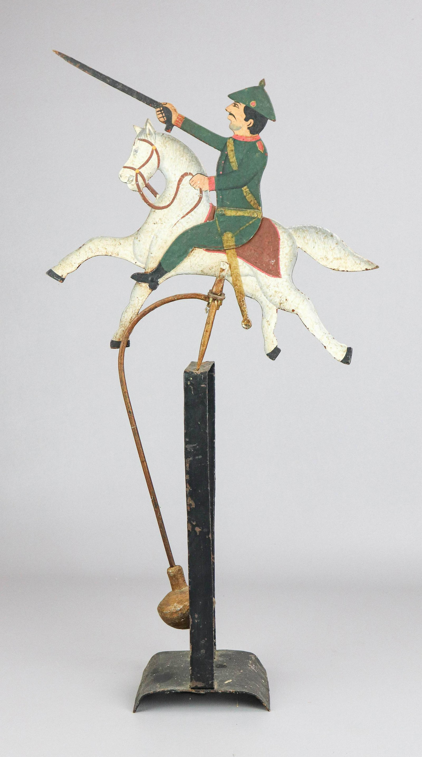 Soldier on Horse Balance Toy: Soldier on horse balance toy, cast iron distress painted horse and rider in military uniform with outstretched bayonet, 26" H