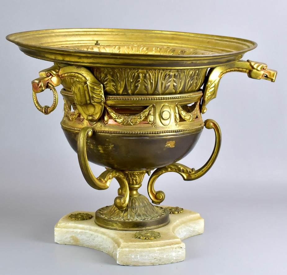 Gilt metal urn on alabaster base w/ dragon heads: Gilt metal urn on alabaster base w/ dragon heads, urn with pierced swag decoration, 15-1/2"h x 22"diameter, light wear to gilt
