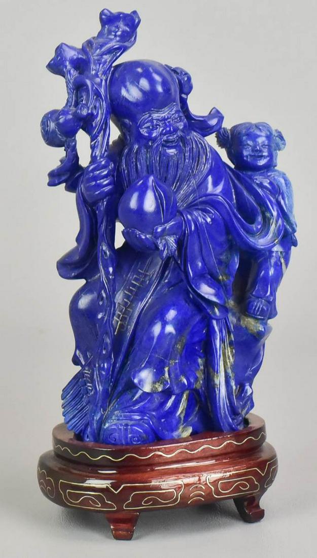 Chinese Carved Blue Stone Figure: Chinese carved blue stone figure, elder with child, 6-3/4" h, with fitted carved wood base