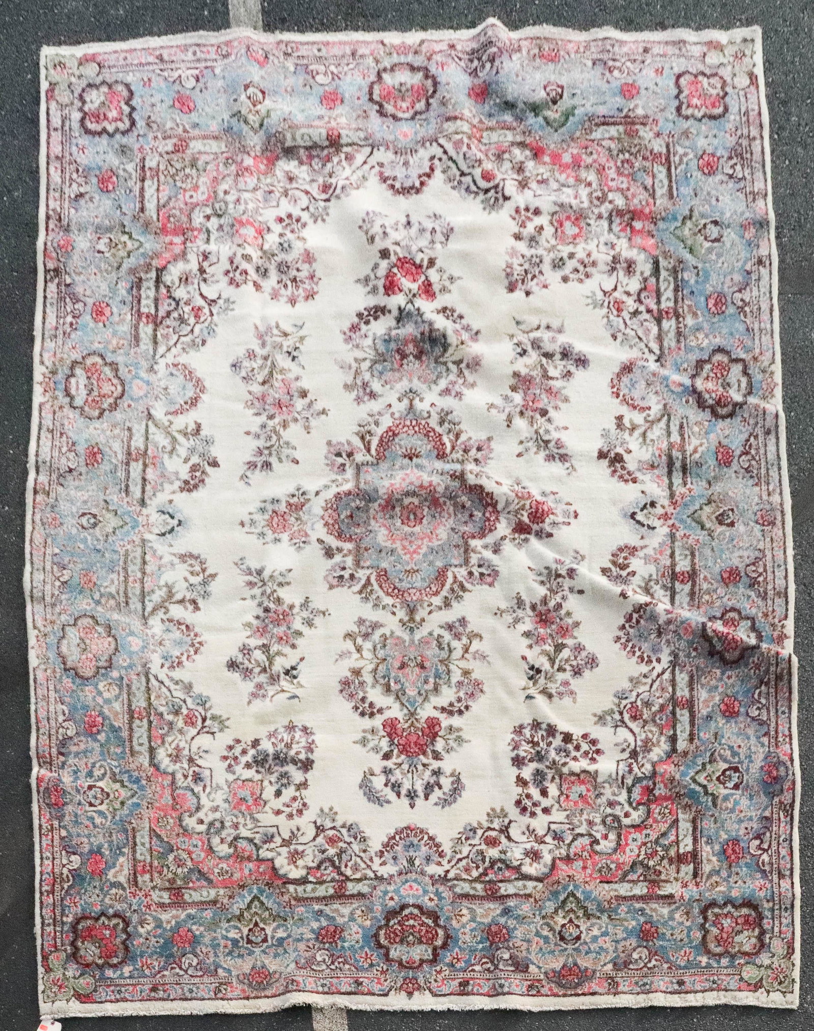 7'3" X 10'2" Kirman Room Size Rug: 7'3" X 10'2" Kirman Room Size Rug; areas of low pile and wear