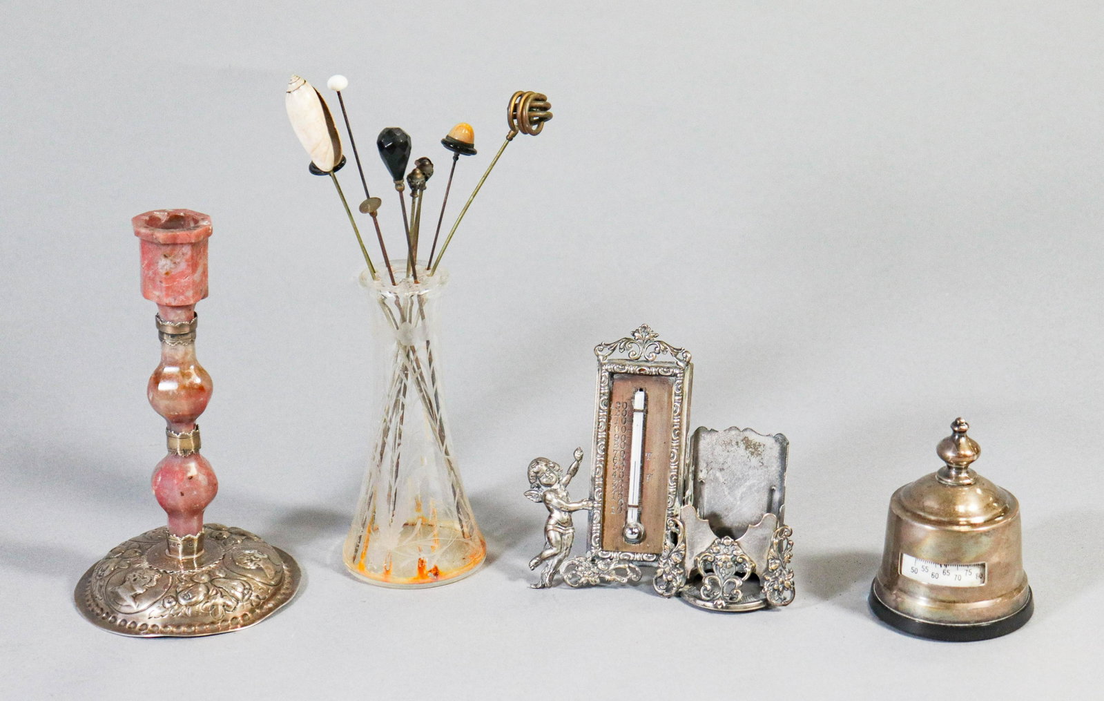 Silver and Sterling Candlestick and Accessories: Silver and sterling candlestick and accessories to include sterling mounted thermometer, embossed plate putti decorated thermometer and stand, embossed sterling and agate candlestick, damage to agate,