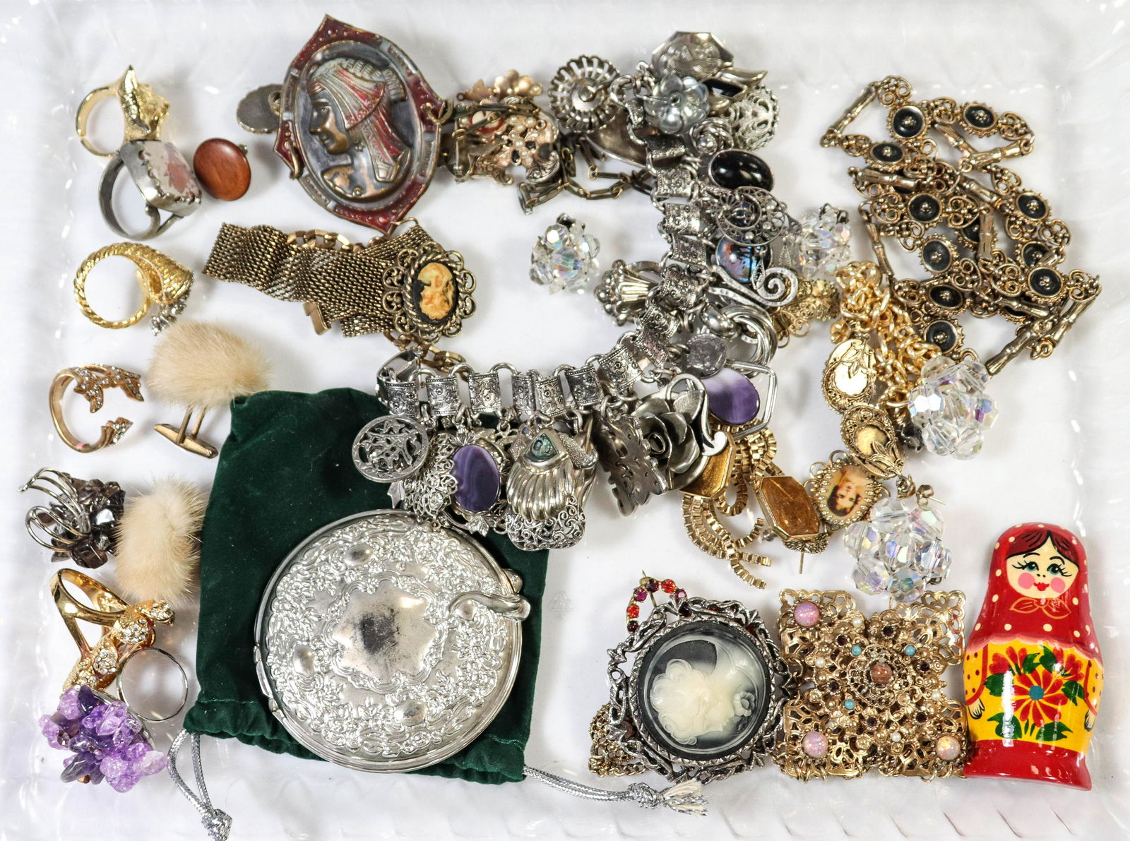 Costume Jewelry Group: Costume Jewelry Group; Lot C/O; 7 fashion rings, (1) silver plated compact mirror, (1) pair of fuzzy cufflinks; (3) pins, (5) earring sets, one pair signed Trifari, (1) Matryoshka doll magnet, (1) cha