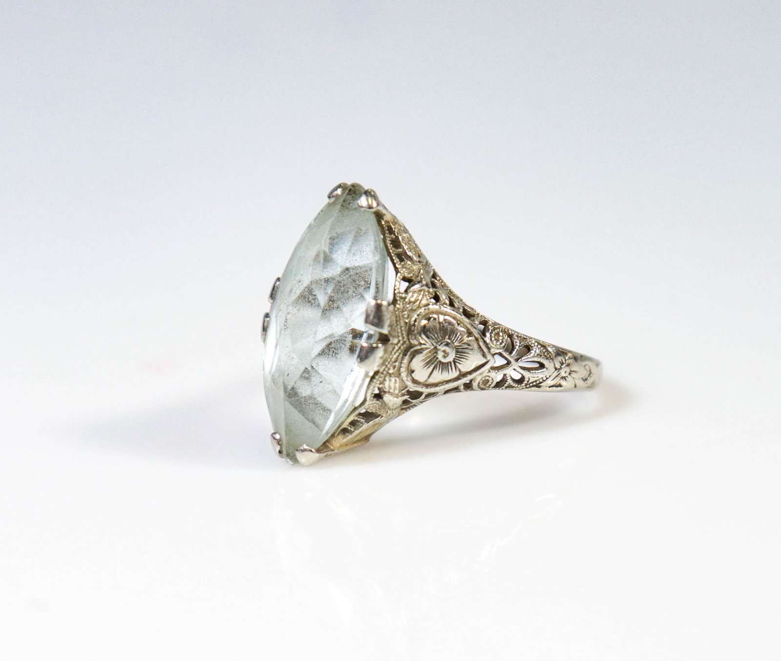 14K WG Marquise Shaped Filigree Ring: 14K WG Marquis Shaped Filigree Ring, light blue stone, 2.2 dwt, Needs cleaning, surface scratches, size 7.