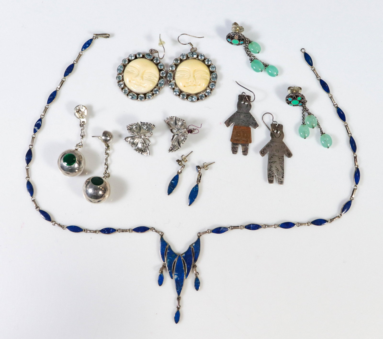 (7) Pc Jewelry Lot: (7) Pc Jewelry Lot C/O: (1) Lapis link necklace, and (1) pair of matching earrings, (1) pair of silver dangle earrings with green stones, (1) signed pair of silver earrings with oversized earring back