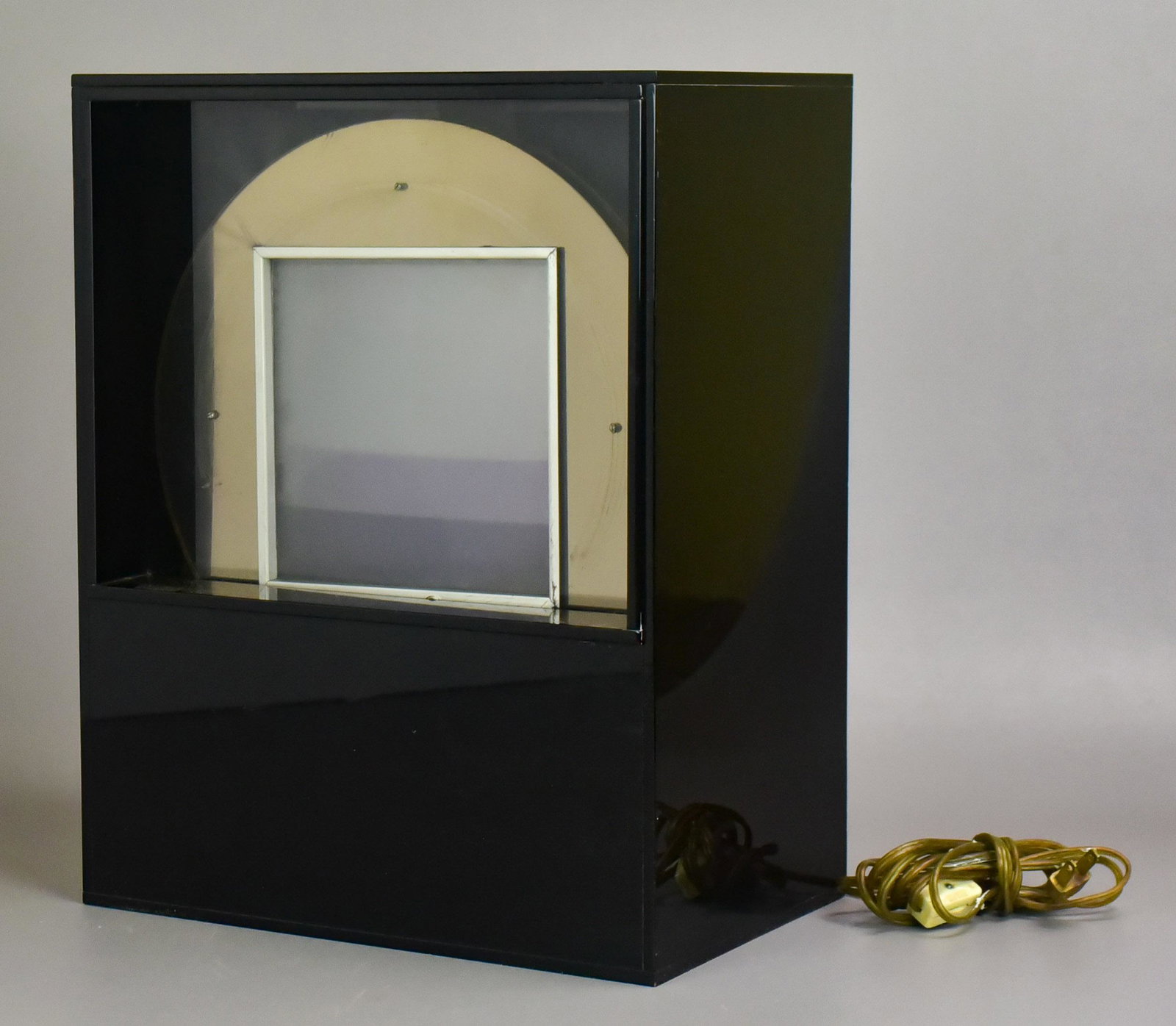 Modern Kinetic Light Sculpture: Modern kinetic light sculpture, black acrylic with rotating fluid filled disk lighted from behind, unsigned, 15-1/4" x 12" x 7-3/4", good working condition