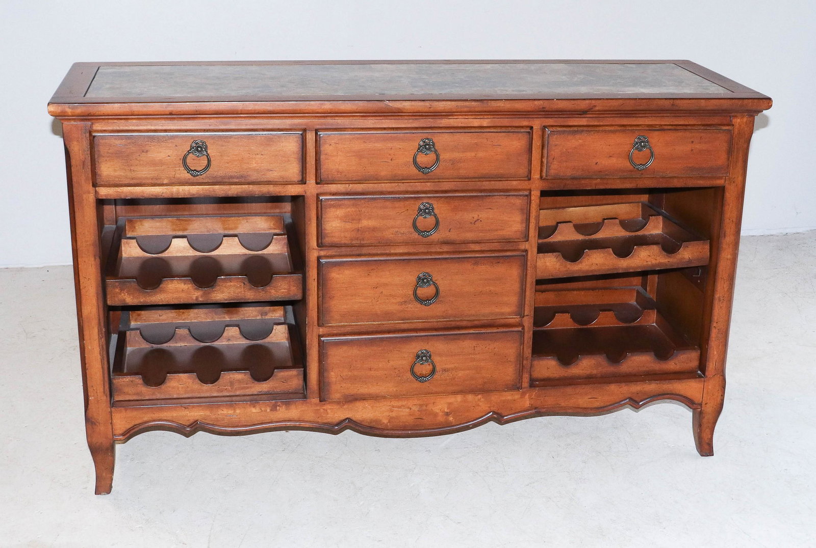 Henry Link marbletop credenza: Henry Link marbletop credenza, three drawers over three drawers, wine rack on each side, top with marble insert, 35" h x 61"w x 20"d