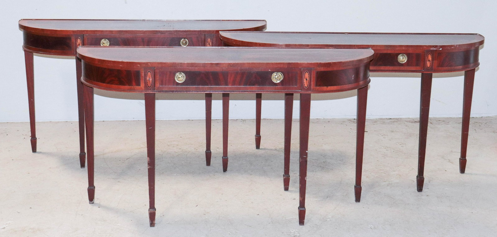 (3) Mahogany Hepplewhite style demilune console tables: (3) Mahogany banded Hepplewhite style demilune console tables, single drawer, 30"h x 53"w