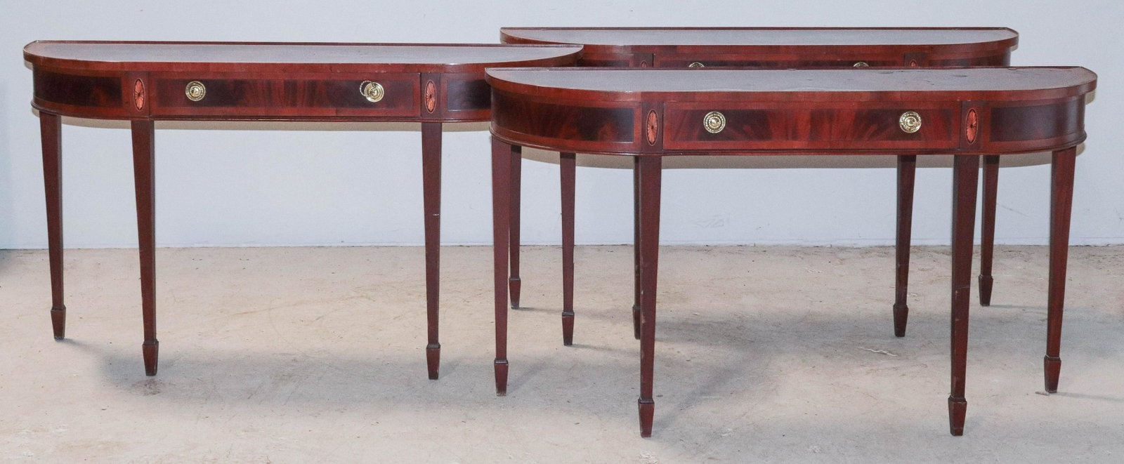 (3) Mahogany Hepplewhite style demilune console tables: (3) Mahogany banded Hepplewhite style demilune console tables, single drawer, 30"h x 53"w