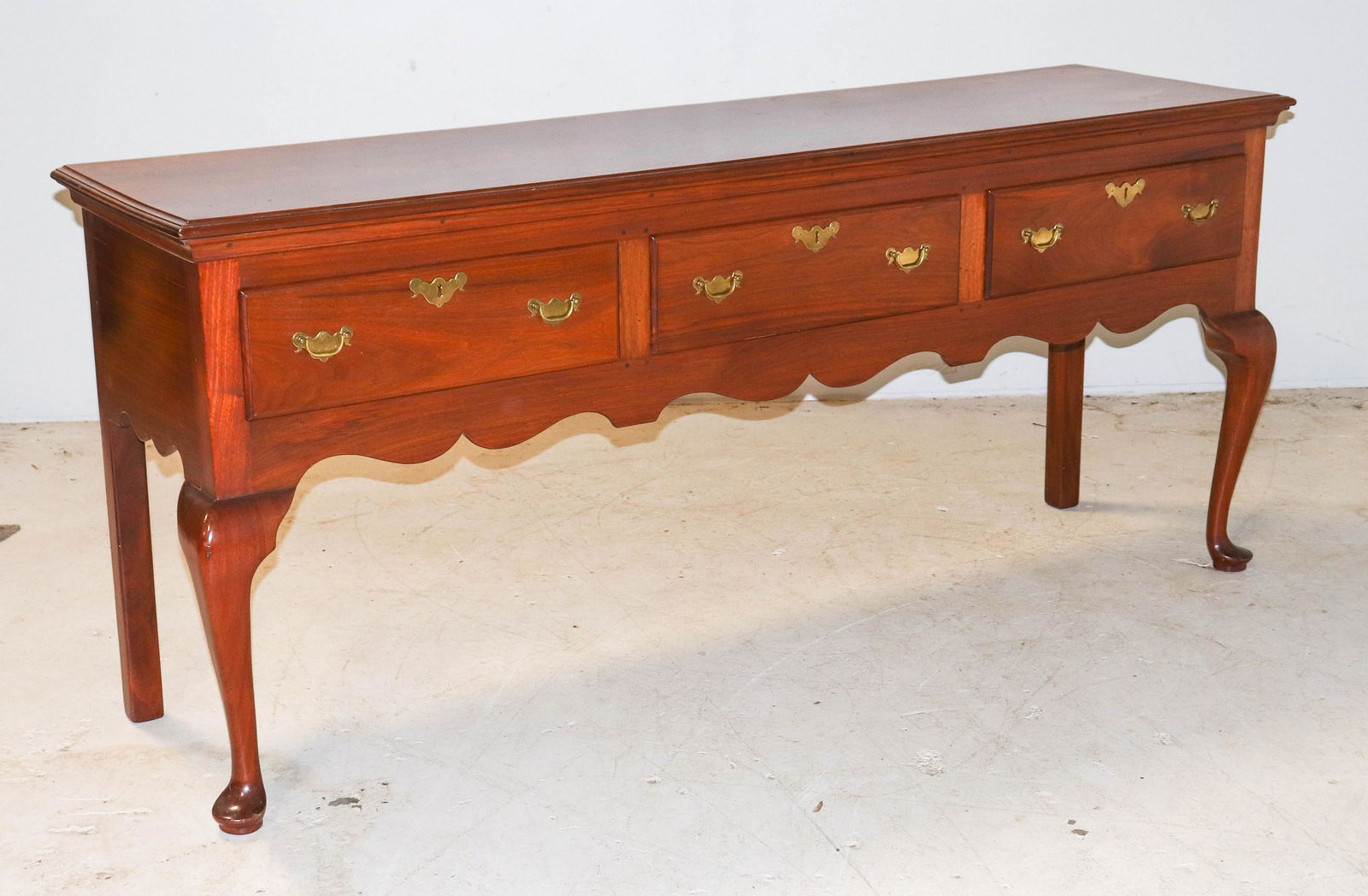 Robert Whitley Walnut QA style sideboard: Robert Whitley Walnut QA style sideboard, three drawers, scroll cut skirt, 34"h x 78"w