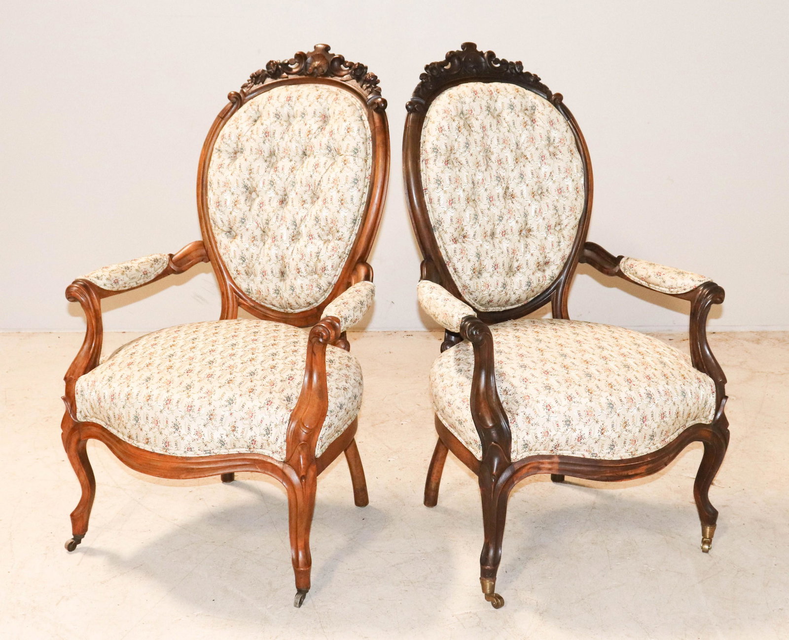 Pair Victorian carved walnut armchairs: Pair Victorian carved walnut armchairs, tufted upholstered back, 41"h, seat height 17-1/2"h, one with darker finish