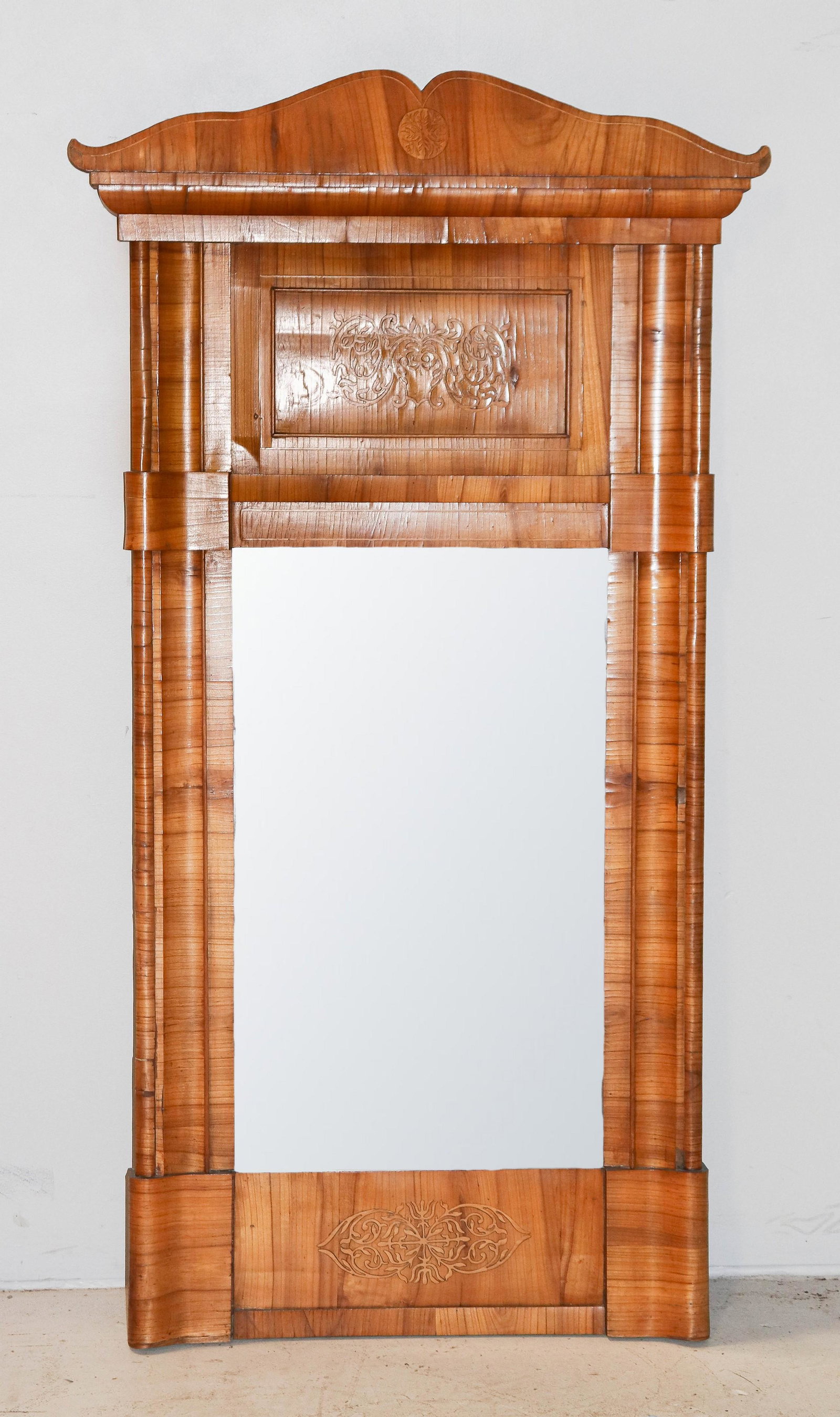 Inlaid Biedermeier pier mirror: Inlaid Biedermeier pier mirror, scalloped crest with inlaid decoration, paneled insert with scrolled leaf decoration, 61-1/2"h x 32"w