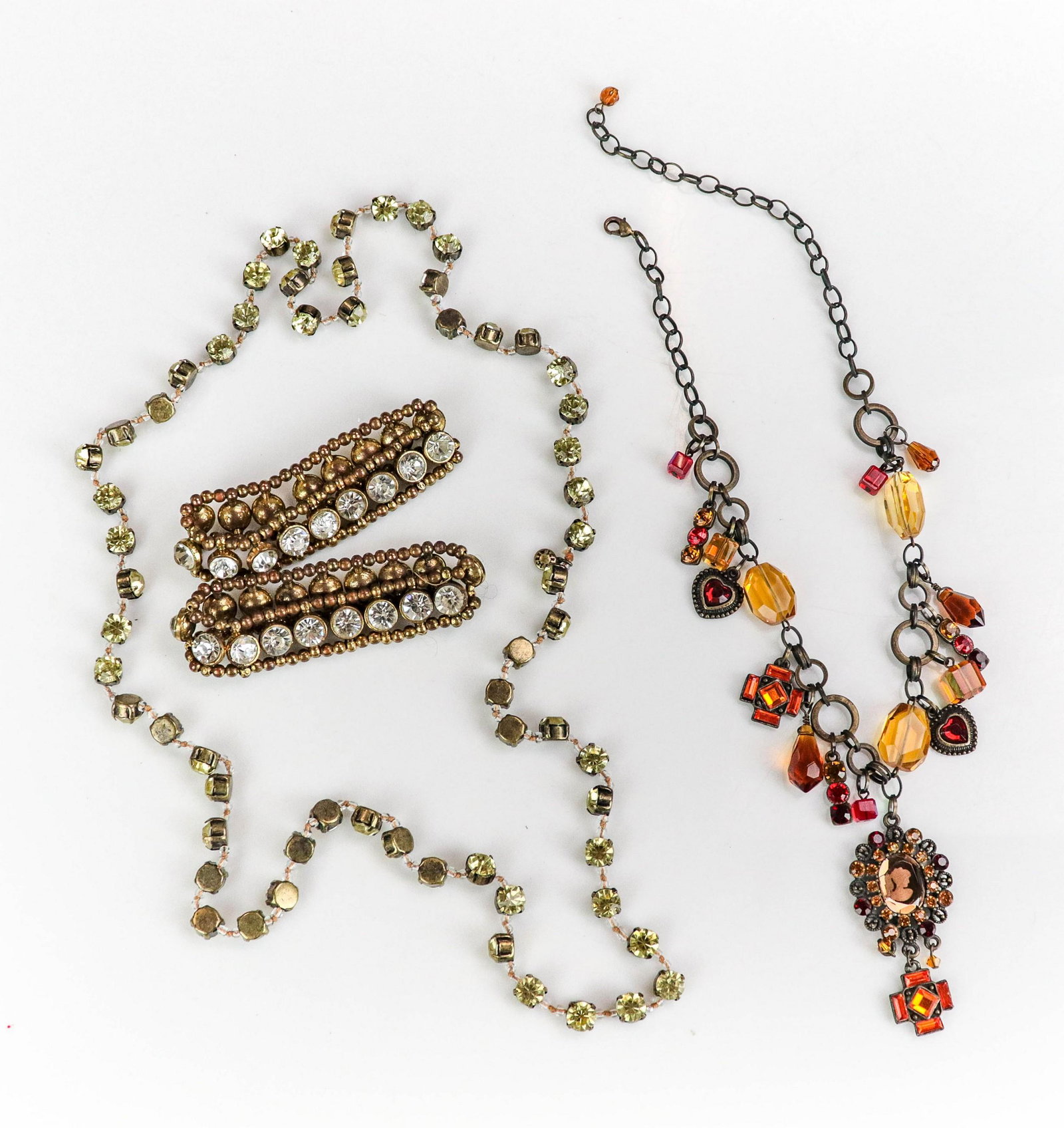 (4) Pc Edgy Fashion Jewelry Brass Tones: (4) Pc Edgy Fashion Jewelry Brass Tones, lot C/O: (2) Stretch crystals bracelets unsigned, (1) 34" Crystal cup chain 8mm, (1) 20" crystal necklace, glass crystal cameo focal and Red-Orange dangle crys