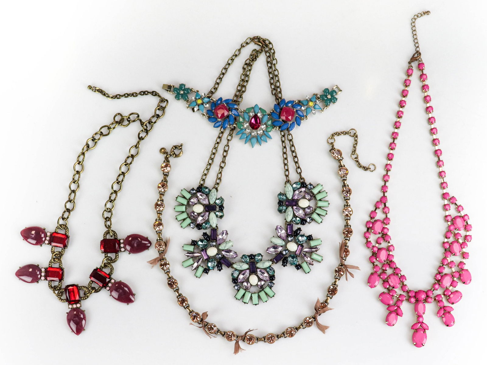 (5) Pc Lot J. Crew, Sugar Fix and Fashion Jewelry: (5) Pc Lot; J. Crew, Sugar Fix and other Fashion Jewelry; Lot C/O; (1) J. Crew bezel set pink crystals in brass tone metal, (1) Sugar Fix bib necklace purples, mint, and blue tones, (1) Hot pink bob n