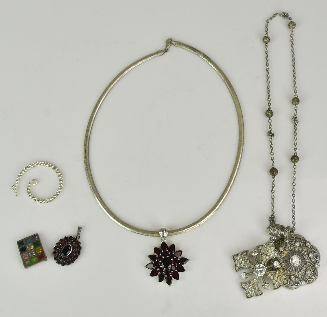 Sterling Silver Jewelry Group: Sterling Silver Jewelry Group C/O; (1) Sterling silver omega garnet pendant necklace, (3) sterling silver pendants, (1) Sterling Silver necklace with two cz pendants, 2.6 Oz.
