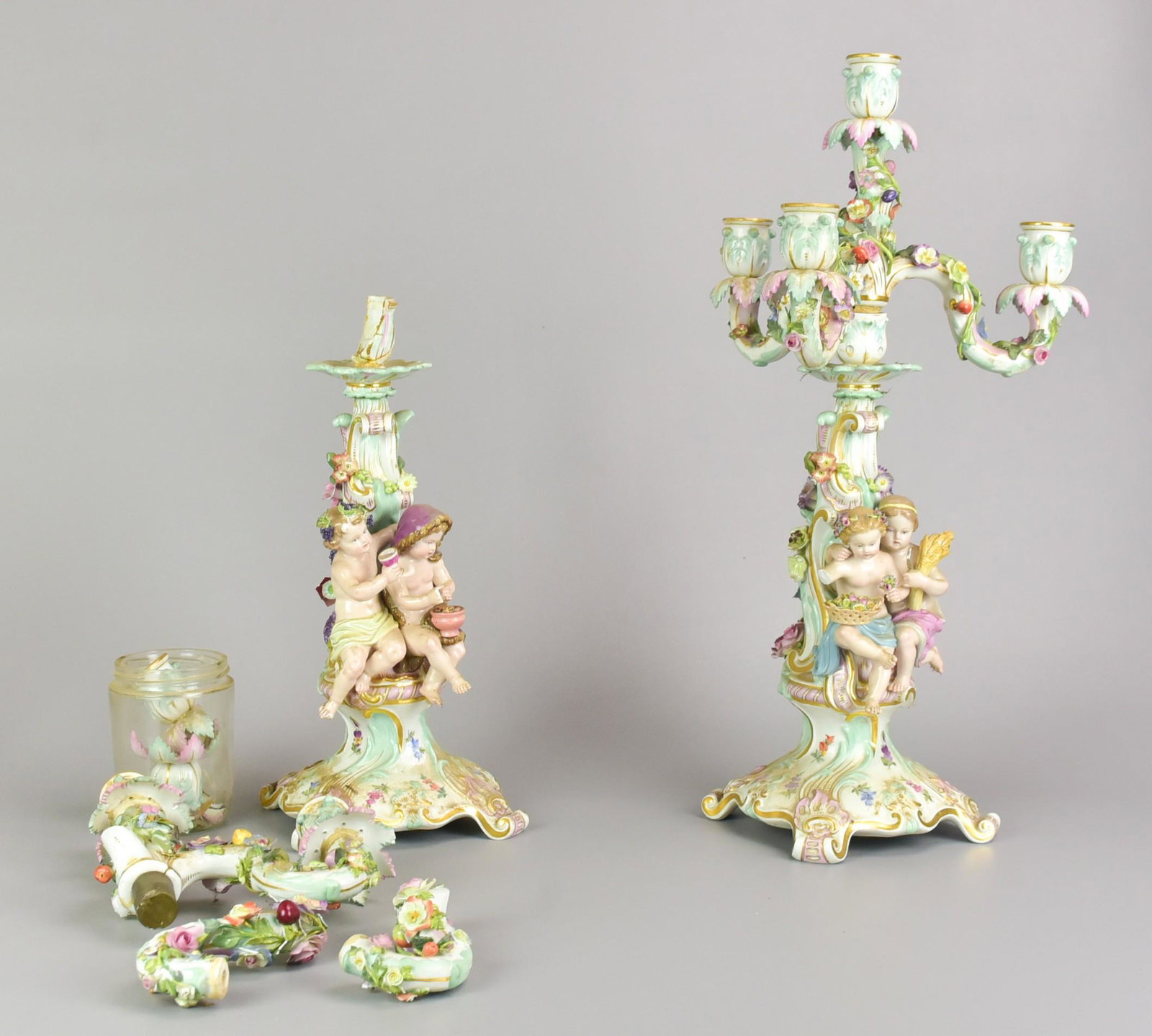 Pair 4-Light Meissen Candelabras: Pair of 4-light Meissen candelabras 1860-1924. One with figures emblematic of "Summer" and "Winter," the other with "Spring" and "Autumn." Each with underglaze blue crossed swords marks, One incised "