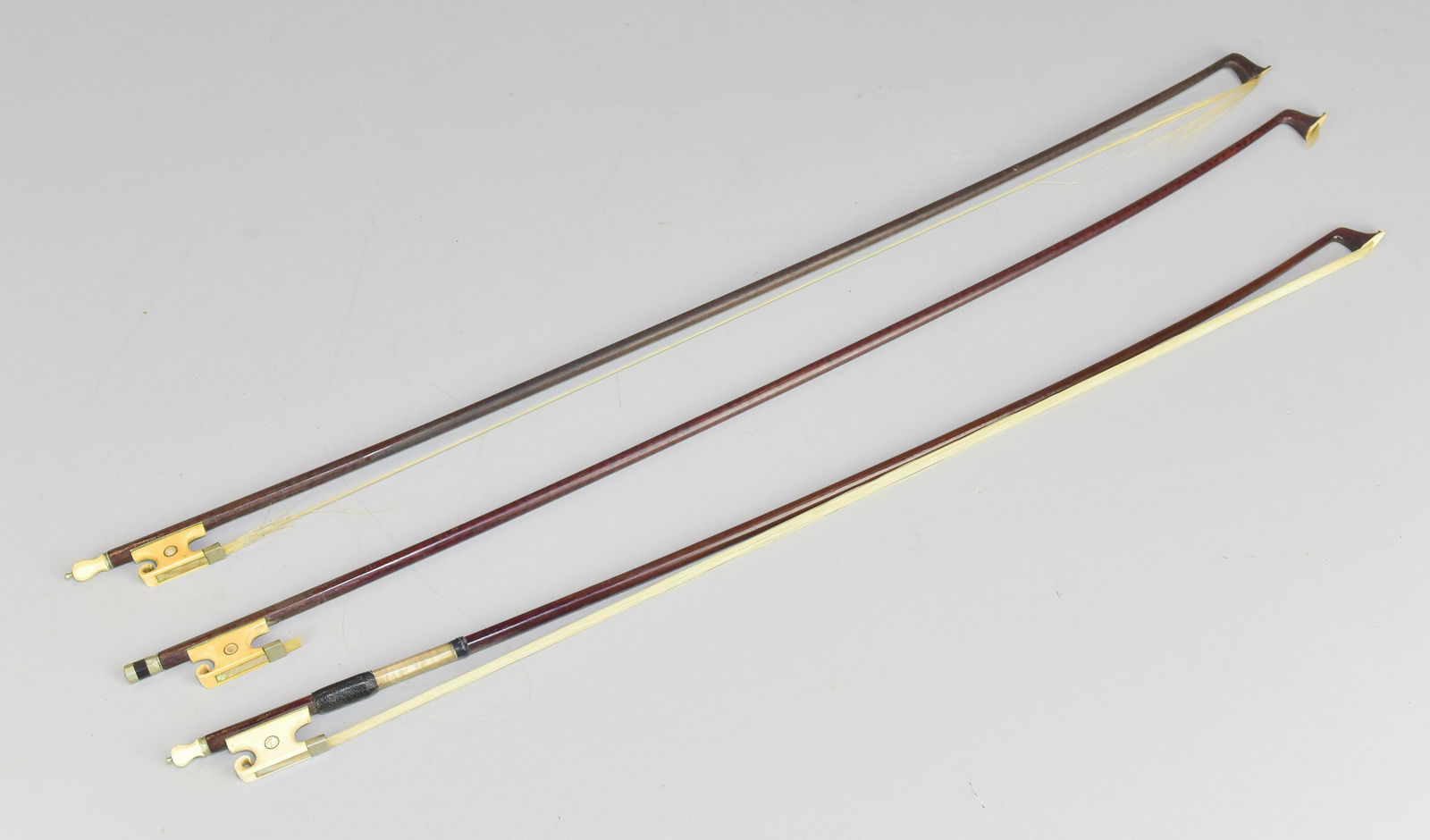 (3) Violin Bows with Whale Bone Frogs: (3) Violin bows, ornate abalone inlaid whale bone frogs, all need to be rehaired