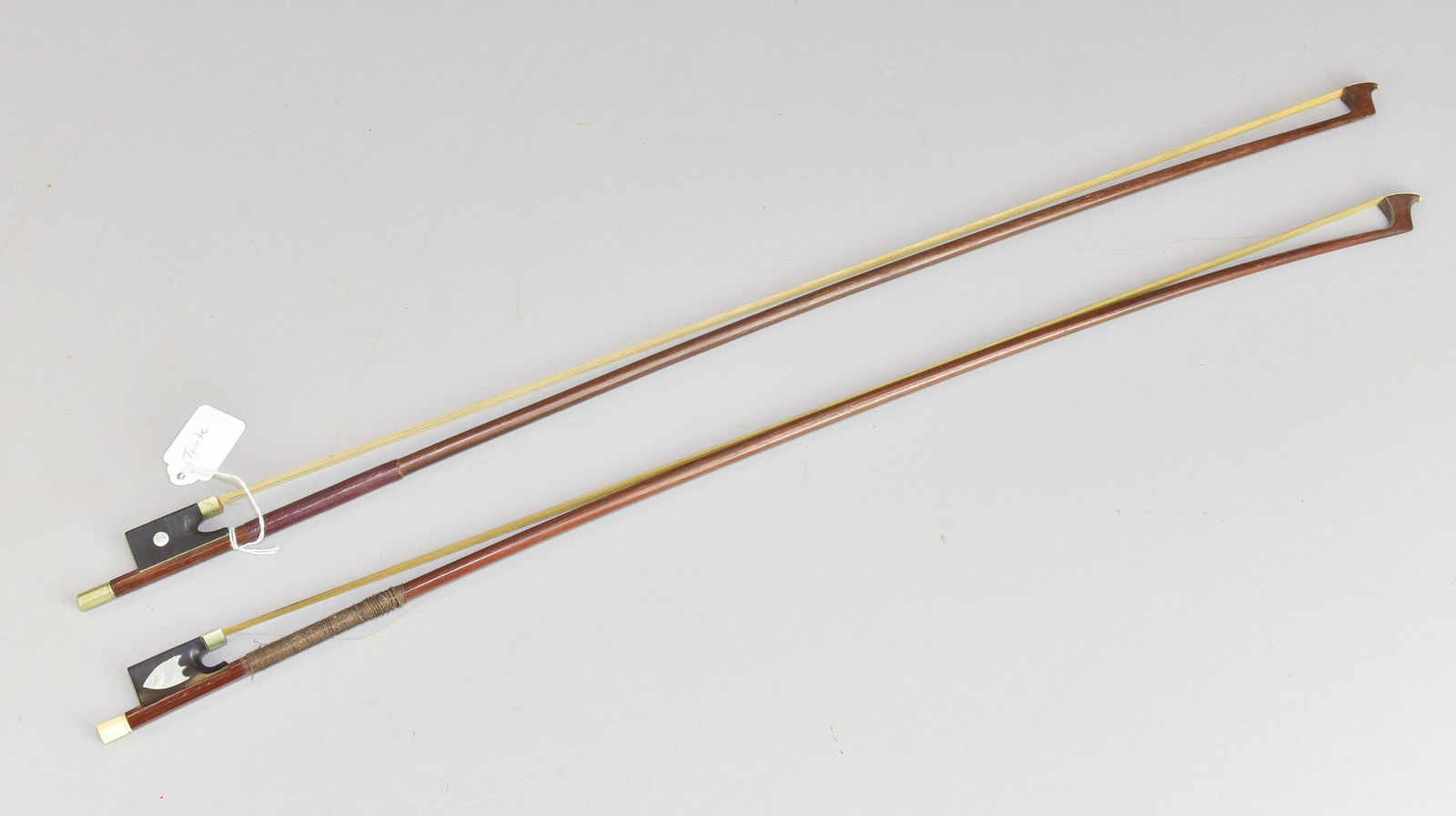 (2) Violin Bows Tourte: (2)Violin bows, c/o Francois Xavier Tourte with mother of pearl inlaid ebony frog marked "Tourte", unmarked with shield shaped abalone inlaid frog