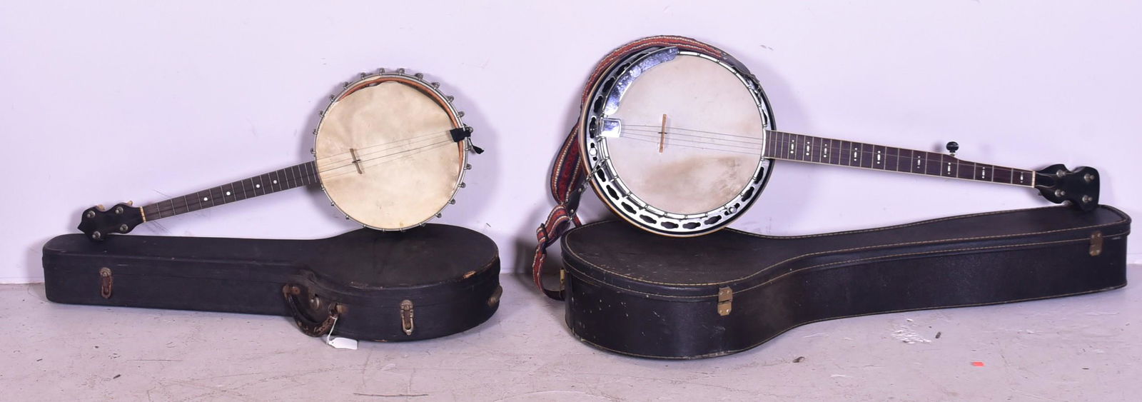 (2) Banjos: (2) Banjos, c/o Fairbanks Banjo made by the Vega Company style F 4-string open back (needs new drum head), and unmarked 5-string closed back, longest 37"