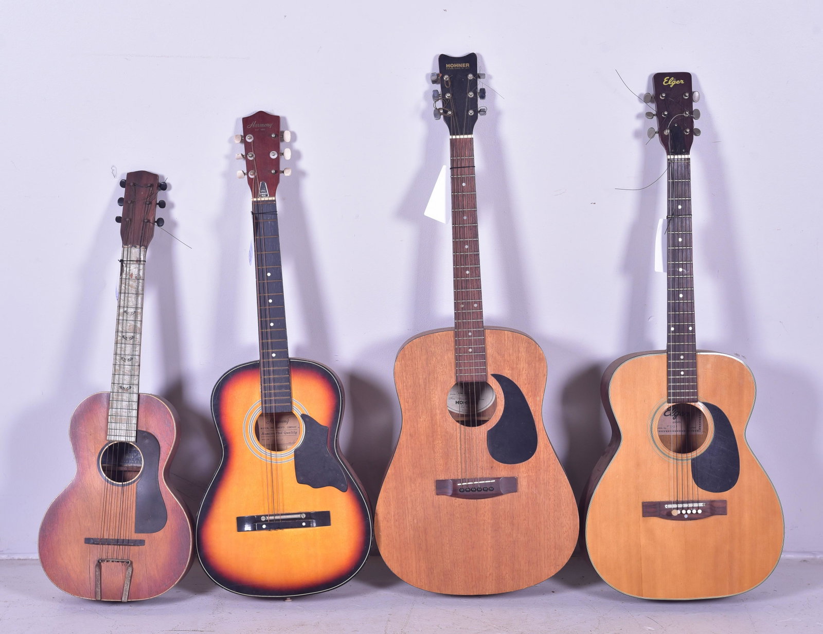 (4) Acoustic Guitars: (4) Acoustic 6-string guitars, c/o Elger model F301, Hohner Countryman Model HW-300CM, Harmony Supertone (splits in body), Harmony Model H0401P