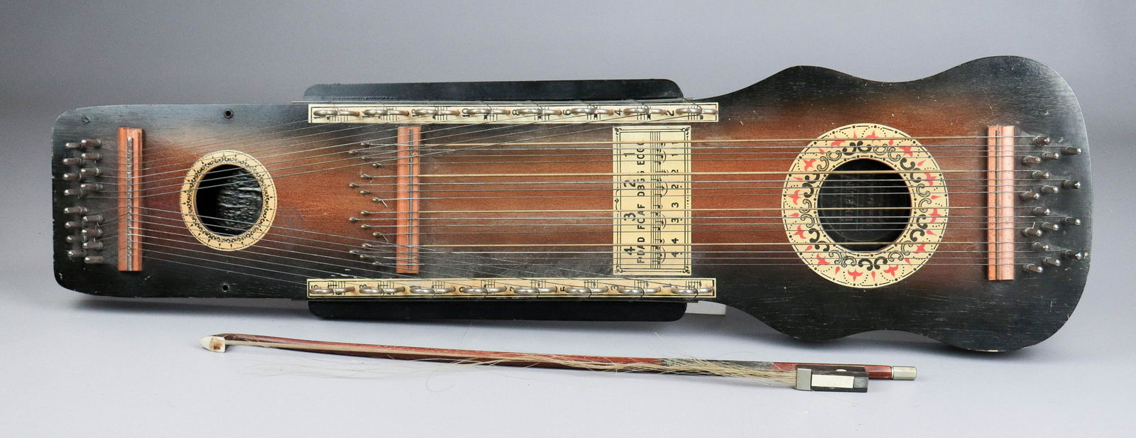 1920's Two Hole Ukelin: 1920's Two Hole Ukelin, combination violin & Hawaiian ukulele, Manufacturers Advertising Co label inside, with bow, c 1920s