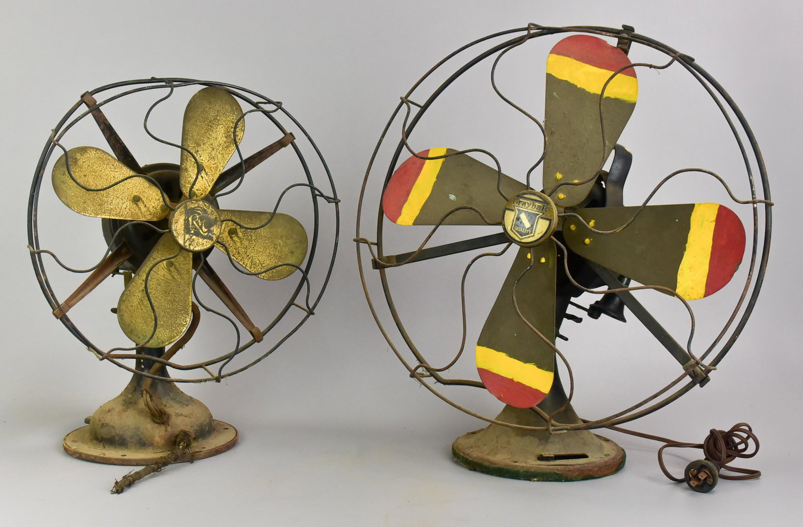 (2) Early 20th c. Fans: (2) Early 20th c. fans to include Graybar Quality fan with paint decorated blades, 17-1/2" diam, dent in frame and Robbins & Myers brass blade fan, damage to body and frame, both need rewired.