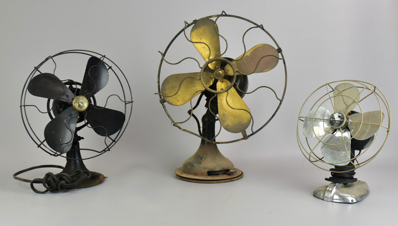 (3) Vintage Table Fans: (3) Vintage table fans to include Mastercraft Art Deco mounting fan, 9" diam, Graybar quality 4-blade fan, 10-1/2" diam and Westinghouse 164848 pre 1950's fan, missing emblem at center, 13" diam, need