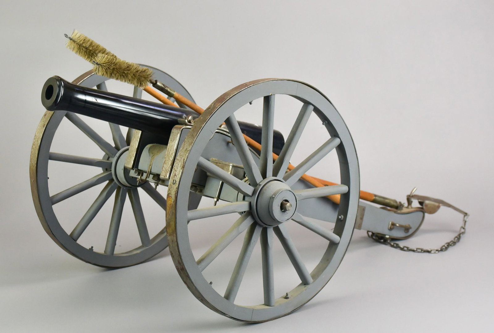 Miniature Civil War Style Cannon: Miniature Civil War style cannon, 2 ramrods/cleaning rods, 14-1/8" long barrel, 28" l overall, wheels 11-1/2" dia, workable but unsure of working condition