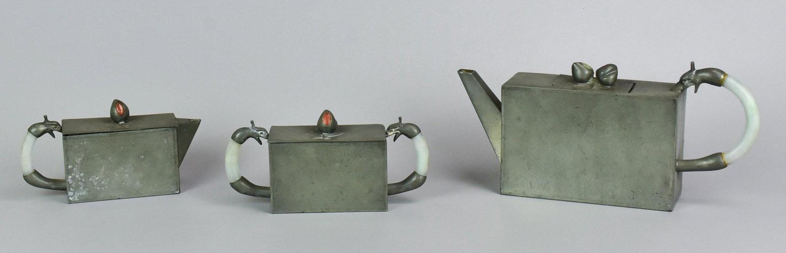 3-Piece Chinese Pewter and Hardstone Tea Set: 3-Piece Chinese pewter and hardstone tea set to include teapot, body measuring 5-3/4" L x 3-3/4" H, creamer 3-3/4"Lx2-1/2"H and sugar measuring, 3-3/4"Lx2-1/2"H, Undersides stamped "CHINA", dragon for
